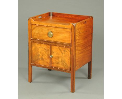 A late Georgian mahogany commode cabinet, with tray type top, drawer, pair of panelled cupboard doors and raised on legs of s