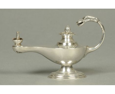 An Edwardian silver table lighter, in the form of a classical oil lamp, Birmingham 1902, 99 grams.  Length 15 cm. 