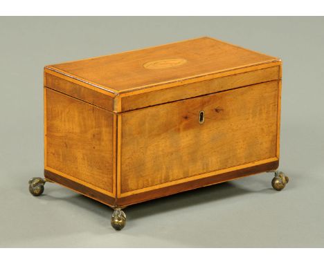 A George III satinwood tea caddy (see illustration).