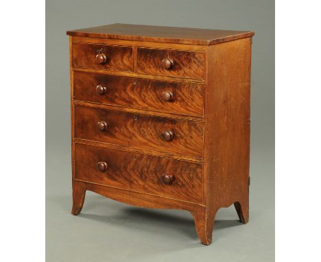 A mahogany chest of drawers, with two short and three long graduated drawers with wooden knob handles and raised on splayed b