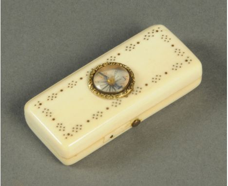 A 19th century inlaid ivory box, with compass top, interior mirror and thermometer.  Length 6.6 cm (see illustration). 