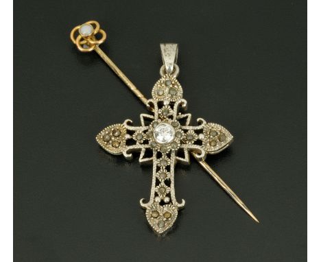 A silver coloured metal cross, marcasite and with paste stone, and an opal set stick pin. 