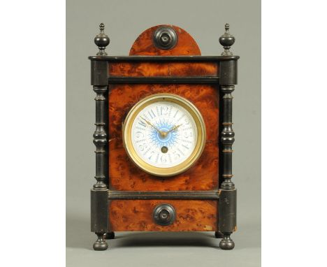 An Edwardian thuya wood mantle clock, with circular blue enamelled dial and single-train movement.  Width 20 cm, height 30 cm
