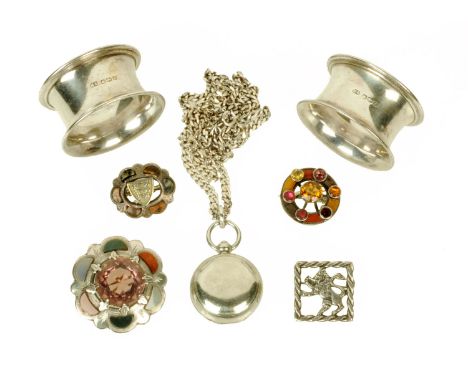A silver plated sovereign case with chain, three Scottish and silver hardstone brooches, Sterling silver brooch and two napki