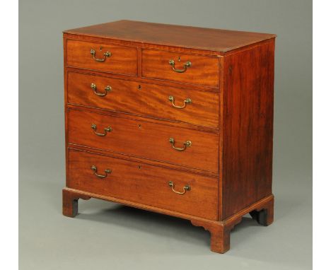 A Georgian mahogany chest of drawers, with moulded edge above two short and three long graduated drawers with brass swans nec