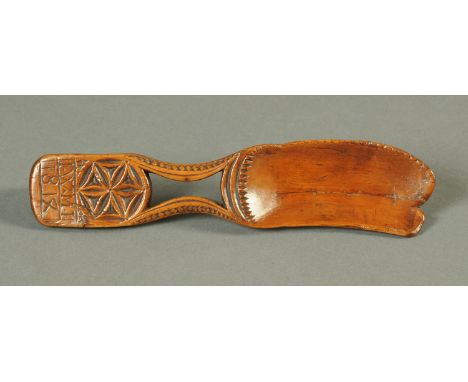 An early 19th century carved sycamore butter comb, inscribed "IWMI 1814", with receipt Mark Seabrook 2006 £425.  Length 23 cm