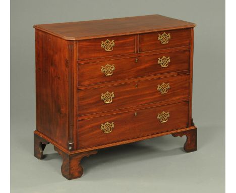 A George III mahogany chest of drawers, with moulded edge and canted angles, with two short and three long graduated drawers 