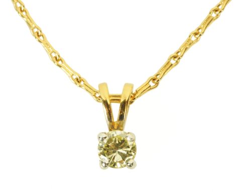 An 18 ct two tone gold pendant on chain, set with a diamond weighing +/- .30 carats.