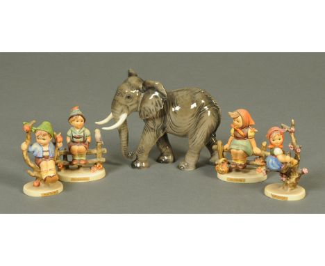 A Goebel elephant figurine, and four M.J. Hummel figurines. 