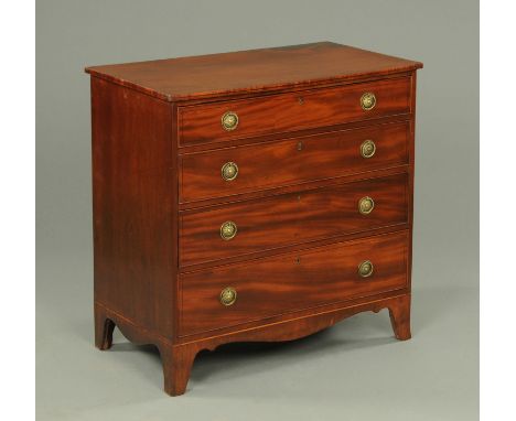 A Regency mahogany chest of drawers, with ebony stringing, four long graduated drawers with brass drop handles with circular 
