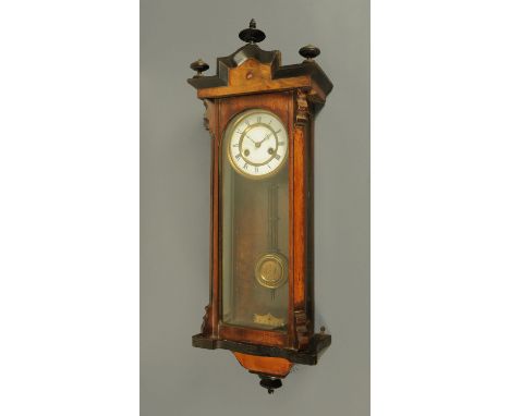 A Victorian walnut and ebonised Vienna regulator wall clock, with two-train spring driven movement.  Height 82 cm. 