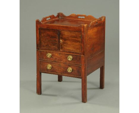A George III mahogany tray topped commode, with pair of cupboard doors above two false drawers and raised on legs of square s