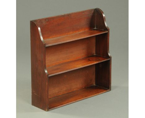 A 19th century mahogany shelf unit, wall hanging, three open tiered shelves.  Width 62 cm.    CONDITION REPORT:  There are mi