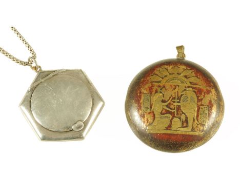 An Art Deco silver pendant ladies compact on box link chain, and an Egyptian Revival enamel and gilt metal pendant compact.  