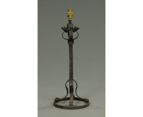 A late 17th century Scottish wrought iron candlestick, converted to a table lamp.  Height excluding light fitting 44 cm.   CO