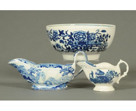 An early Worcester bowl, decorated with fence and chrysanthemums (AF), and two blue and white sauce boats, longest 17 cm.