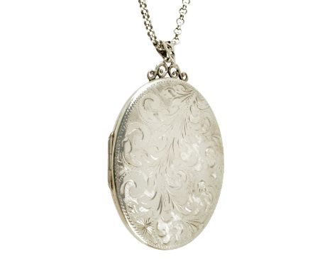 A foliate engraved silver locket, with chain. 