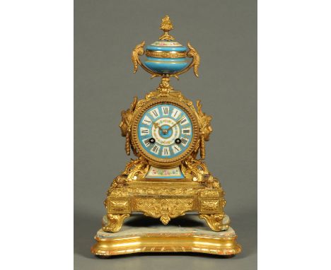 A 19th century French spelter and porcelain panelled mantle clock, raised on a wooden base, two-train movement.  Height inclu