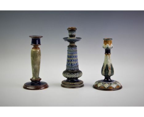 A Doulton Lambeth candlestick, late 19th century, of tapering form, decorated with scrolling floral, foliate and shell motifs