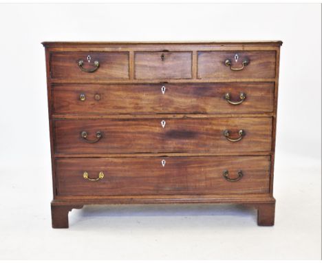 A George III mahogany chest of drawers, the rectangular moulded top above three short and three long drawers, each applied wi