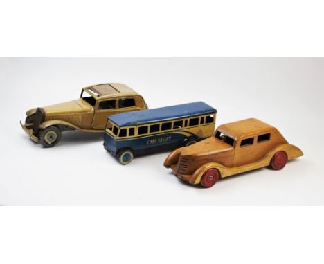 A 1940's tin plate clockwork roadster, in mustard yellow livery with sliding roof, balloon tyres and running boards, Made in 