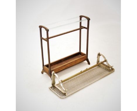 An early 20th century French stained wooden towel rail, with parallel glass rails above a lower tray, on outswept supports, 7