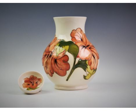 A Moorcroft vase of baluster form, decorated in the Hibiscus pattern against an ivory ground, painted monogram for Walter Moo