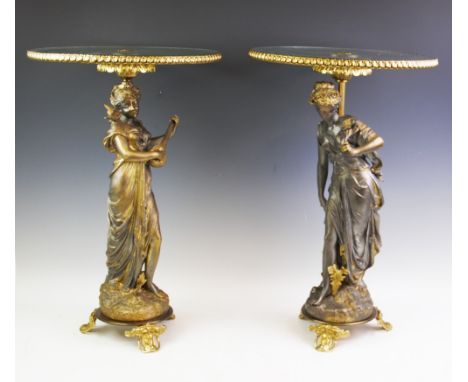 A pair of 20th century classical occasional tables, each with a classical maiden supporting a ormolu mounted circular glass t