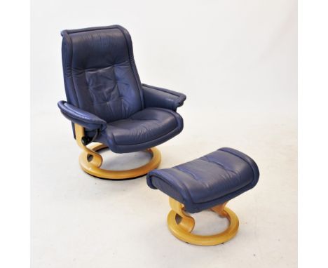 An Ekornes Stressless blue leather reclining easy chair, raised upon a beech wood frame and a revolving ring base, 99cm high,