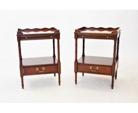 A pair of Regency style mahogany lamp tables, 20th century, each table with a rectangular top and moulded gallery above a sli