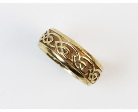 A 9ct Clogau gold ring, with Celtic scrollwork decoration, ring size T 1/2, weight 8.2gms, complete in box 