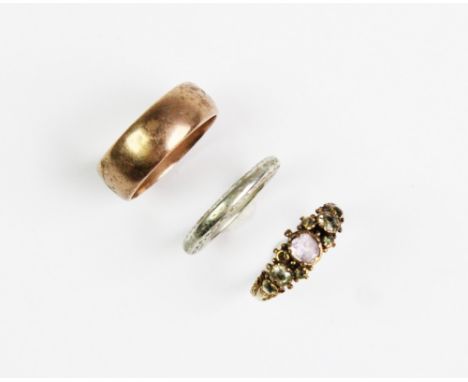 A Victorian yellow metal stone set ring, comprising pink, yellow and green stones set in unmarked yellow metal with beaded de