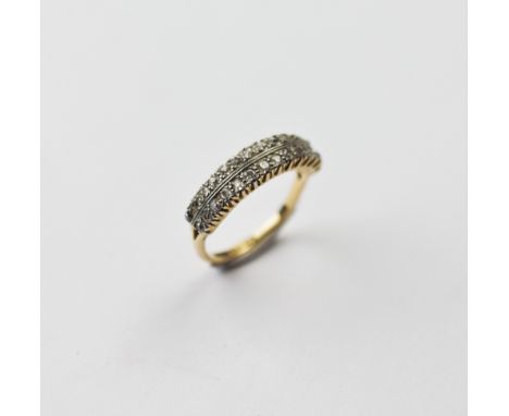 A diamond two-row half-eternity ring, comprising twenty-eight small old cut diamonds claw set in white metal, set to split sh