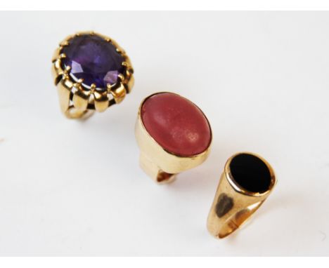An amethyst set 9ct gold ring, the oval mixed cut amethyst claw set to pierced floral design gallery, continuing to tapered s
