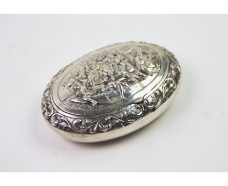 A 19th century Dutch silver snuff box, of oval form, the cover decorated with embossed figures on a barge, all within a folia