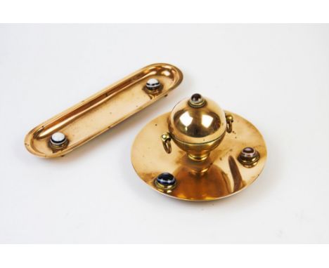 An early 20th century brass globular ink well and pen tidy, the inkwell with hinged cover and brass liner stamped Regent Stre
