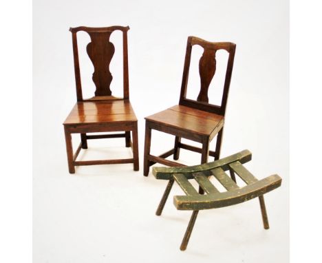 An early 18th century oak chair, with a cupids bow top rail above a vase shaped splat and board seat, 90cm high, a second sim