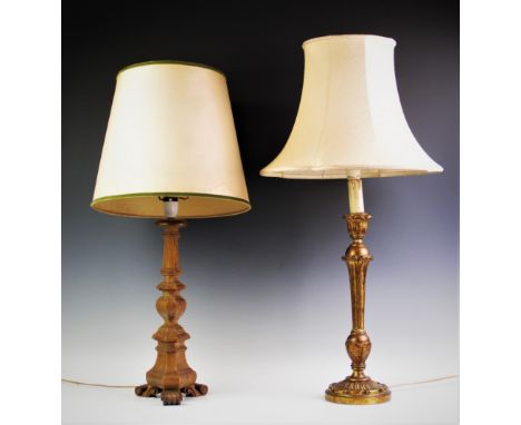 A knopped tri-form yew wood table lamp on scroll feet, complete with shade, 74cm high including shade, with a gilt wood colum