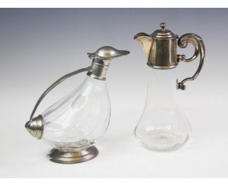 An Edwardian silver mounted claret jug, Birmingham 1910, the fittings with plain polished finish, scrolling handle, hinged co