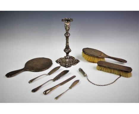 A silver backed dressing table set, Henry Matthews, Birmingham 1924, comprising; two brushes and a hand mirror, with a white 