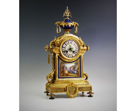 A 19th century French ormolu and porcelain panel mantel clock with Japy Freres movement, the gilt brass case surmounted with 