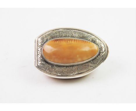 A 20th century white metal mounted shell snuff box, the shell designed with white metal collar, the hinged cover with central