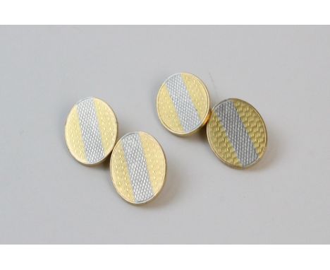 A pair of 18ct gold cufflinks, the two-toned oval cufflinks with engine turned decoration, measuring 1.8mm x 1.4mm, weight of