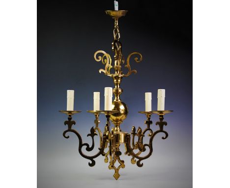 A brass five branch ceiling light fitting, the globular knopped shaft with five scrolling upper branches above five graduated