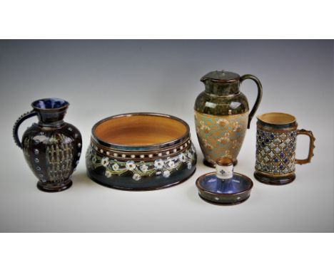 A Doulton Lambeth fruit bowl, early 20th century, decorated by Marion Holbrook in a scrolling pattern of forget-me-not swags,