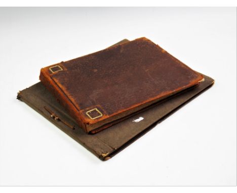 Guy Worsdell, a leather bound sketchbook and a board bound sketchbook, each containing numerous pencil and pen and ink sketch