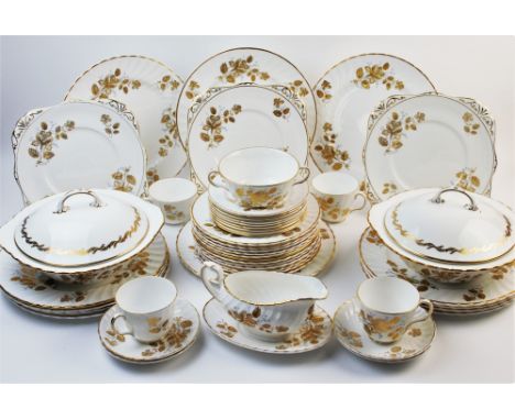 An extensive harlequin gilt dinner service, comprising; fifteen tea cups, seventeen saucers, four dessert bowls, one soup bow