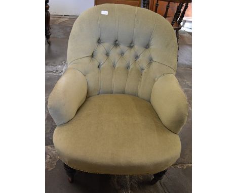 Victorian button back armchair on turned legs with casters