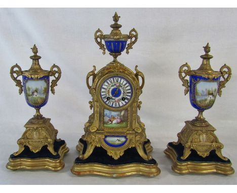 Continental gilt metal and porcelain clock with garniture complete with stands H 42 cm (missing pendulum and key)