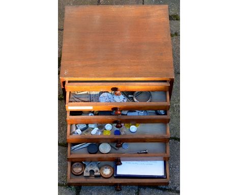 Small wooden 6 drawer cabinet containing watch parts, tools &amp; small tins